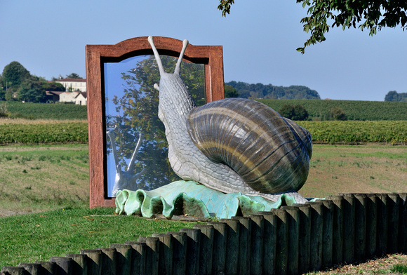 Mirror,Mirror on the wall who`s the fairest Snail of all. Imaginative roundabout decor.Snails are known as Cagouille in the departement of Charent- Maritime.